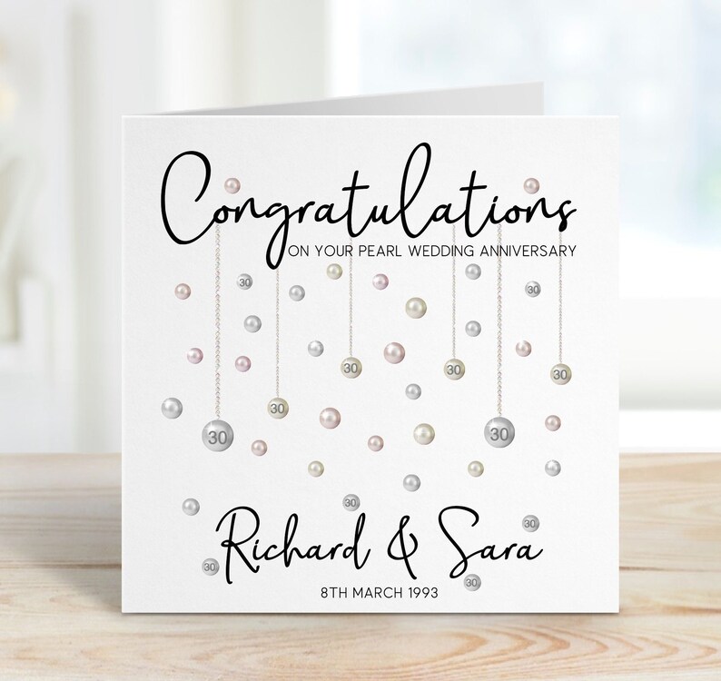Congratulations on your pearl wedding anniversary. Beautiful hanging pearls and personalised with the couples name and date.