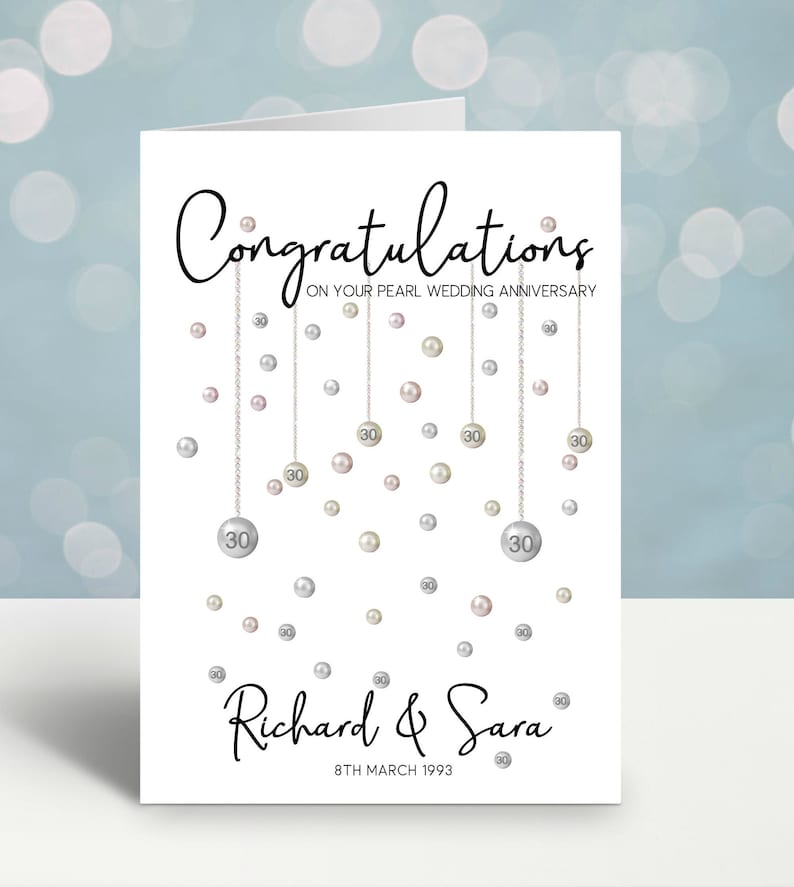 Congratulations on your pearl wedding anniversary. Beautiful hanging pearls and personalised with the couples name and date.