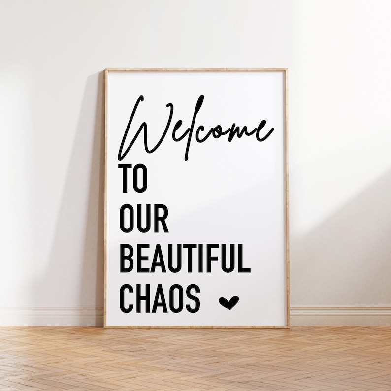 May include: Black and white printable wall art with the text "Welcome to our beautiful chaos" and a small heart symbol.