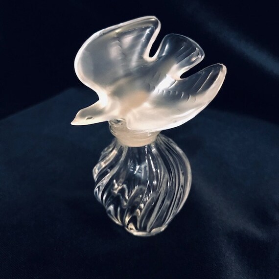 perfume with doves on top