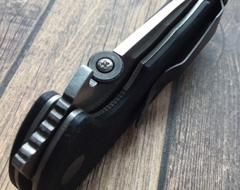 Cuchillos Emerson • Tornillo de repuesto plateado para disco de pulgar Phillips. Compatible con muchos modelos Emerson. Tornillos de mejora para cuchillos personalizados (1 tornillo solamente, sin disco).