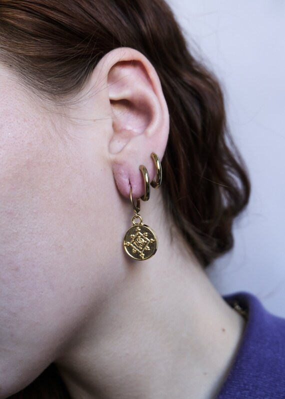 Pair of rings and gold hand-made medallion