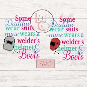 May include: A digital design featuring the text "Some Daddys wear suits mine wears a welder's helmet & Boots" with a welding helmet graphic on the left and a welding helmet graphic on the right. The text is in various colors, including pink, blue, and teal.