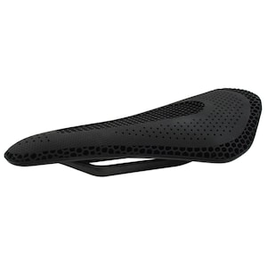 May include: Black bicycle saddle with a honeycomb pattern and a sleek, aerodynamic design. The saddle features a central cutout for ventilation and is supported by a black frame. This bike seat is designed for comfort and performance.