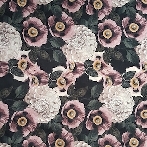 May include: A black fabric with a repeating pattern of pink and white flowers. The flowers are stylized and have a vintage feel.