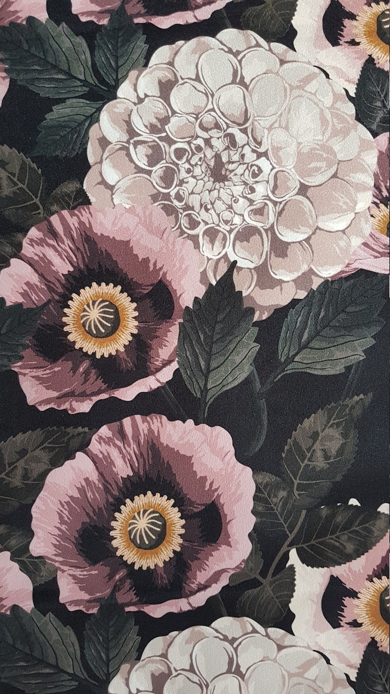 May include: A black fabric with a floral pattern featuring pink poppies and white dahlias. The flowers are surrounded by dark green leaves.