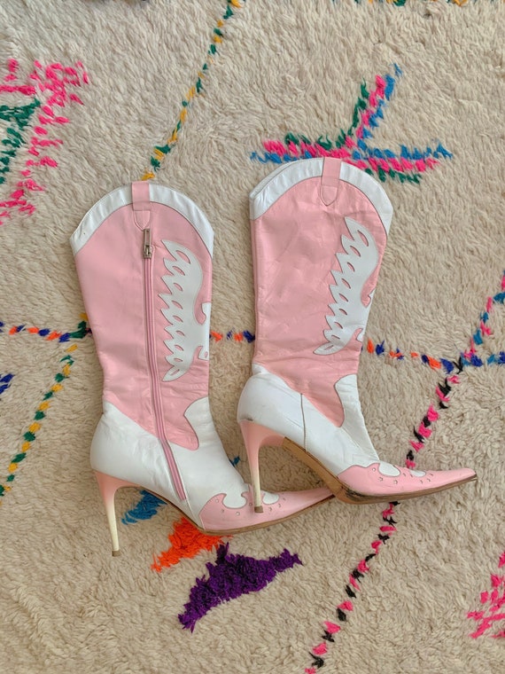 Pink and white cowboy-style heel boots