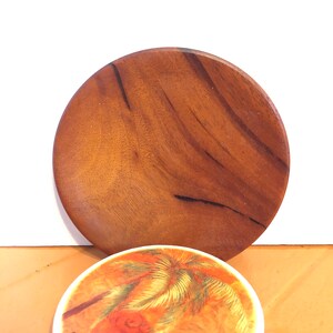A small lathe turned plate made from Fl mahogany, for holding your change or end of the day jewelry,liner for candle