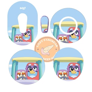 May include: Five colourful round stickers with a cartoon design. The stickers feature two cartoon characters driving a red car with a blue and yellow roof. The stickers have a blue background with white clouds. One sticker has the text "Lazy Pancreas Keep Going" with a cartoon pancreas.