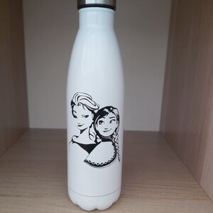 May include: White stainless steel water bottle with a black and white image of two girls with long hair. The girls are wearing dresses and have a crown on their heads.