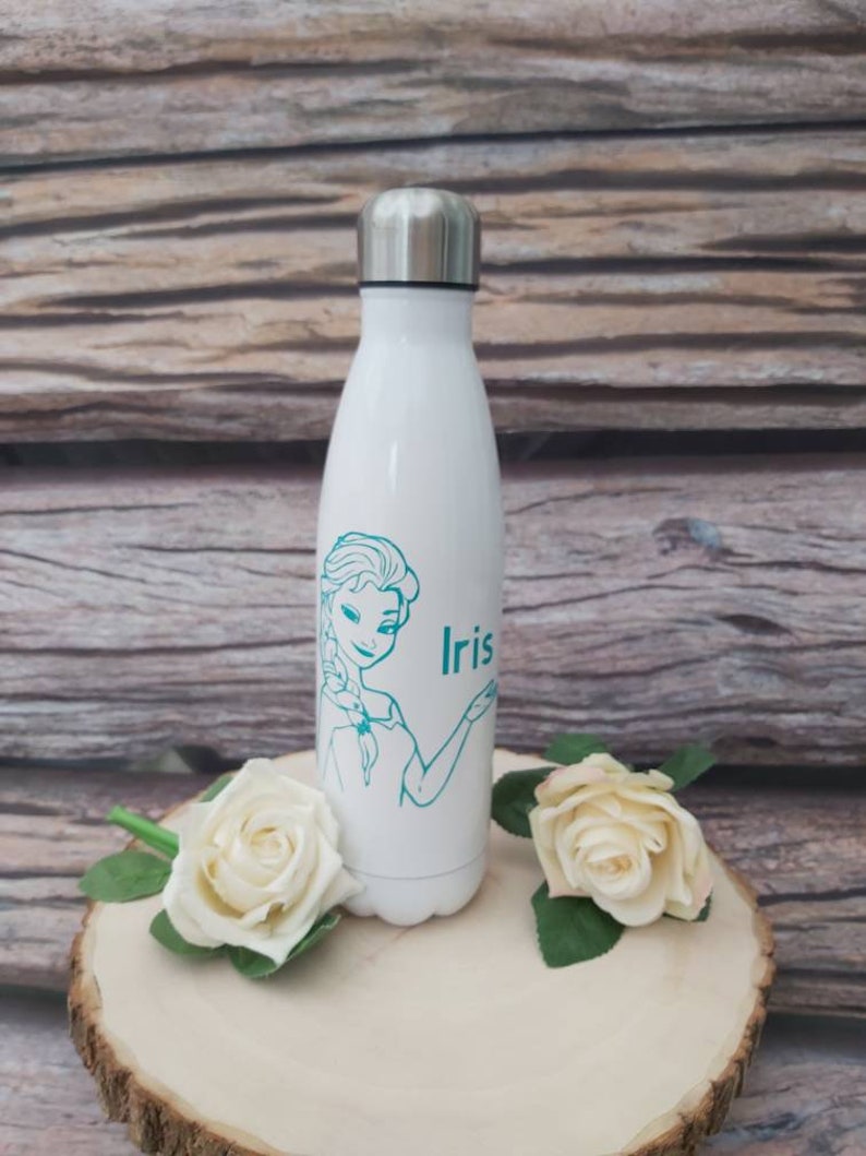 May include: White stainless steel water bottle with a teal outline of a cartoon princess and the name "Iris" printed on the side.
