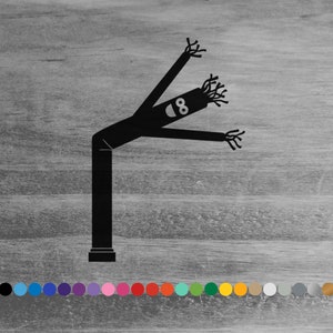 May include: Black inflatable tube man with the number 8 on its chest. The tube man is waving its arms and has a whimsical design.