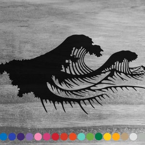 May include: Black silhouette of two stylized waves crashing against each other on a gray wood background.
