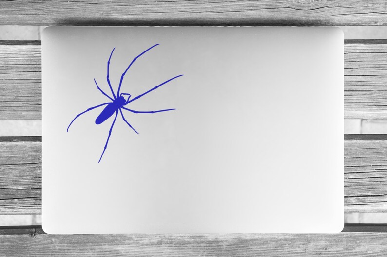 May include: A blue spider silhouette sticker on a white laptop.