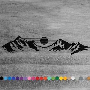 May include: Black silhouette of a mountain range with a sun setting behind it. The mountains are jagged and the sun is a simple circle.