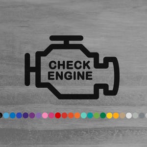 May include: A black vinyl decal featuring the outline of an engine block with the text CHECK ENGINE centered inside. Below the graphic, a horizontal row of small circular color swatches displays the available color options for the decal.