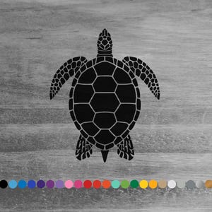 May include: Black silhouette of a sea turtle on a gray wood background.