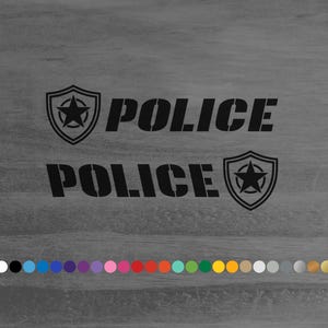 May include: Black and white decal with the word "POLICE" twice, each with a star inside a shield.