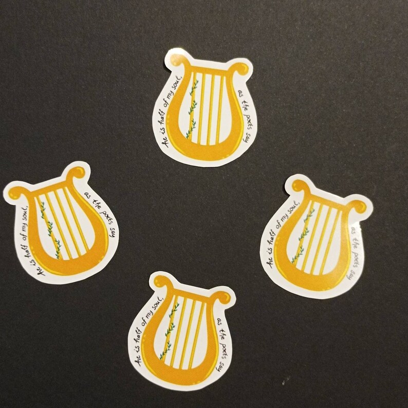 May include: Four yellow and white stickers with a lyre design and the text "He is half of my soul, as the poets say".