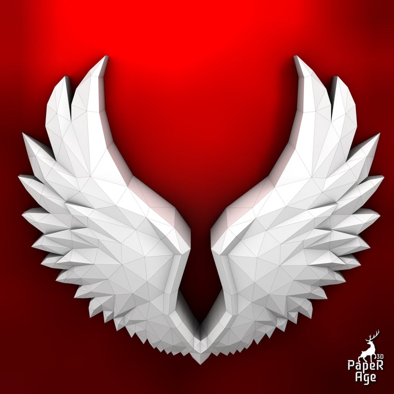 Puede incluir: Alas de papel origami blanco con un dise&ntilde;o geom&eacute;trico. Las alas est&aacute;n dobladas en forma 3D y se colocan sobre un fondo rojo.