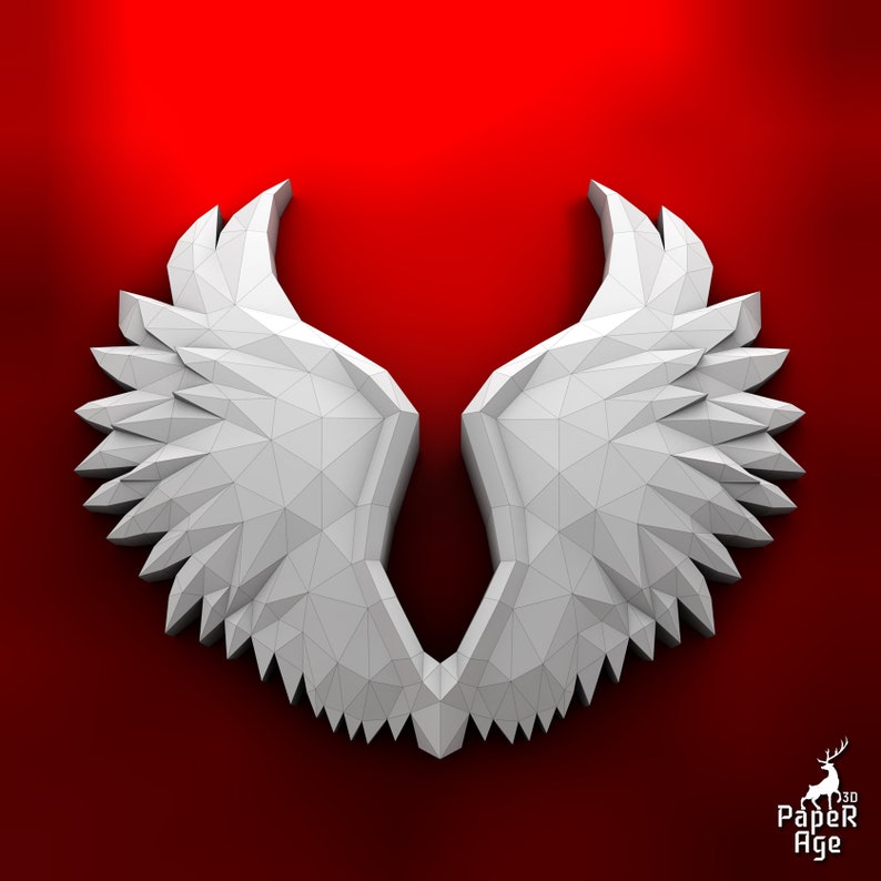 Puede incluir: Alas de &aacute;ngel de papel blanco con un dise&ntilde;o geom&eacute;trico, sobre un fondo rojo.