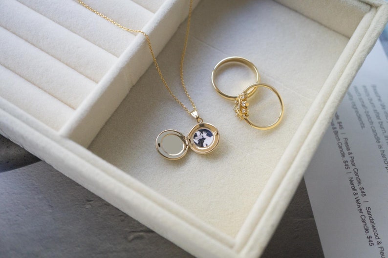 round gold locket with photo
