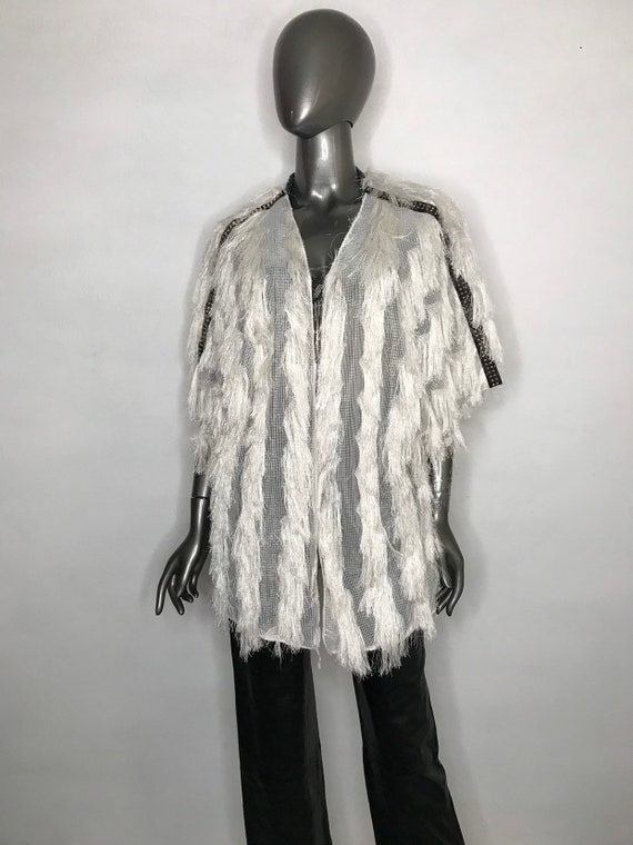 White women's jacket made from textile with fringe