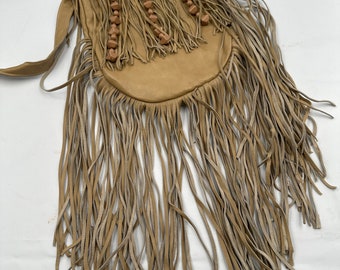 Beige fringe bag w long strap and pockets zipper size small.