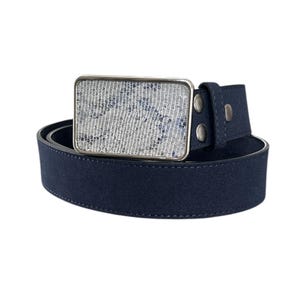 May include: A dark blue leather belt with a silver buckle featuring a white and blue patterned design.
