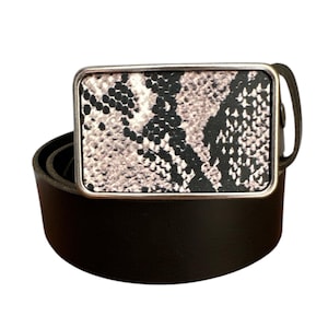 May include: A black leather belt with a silver buckle featuring a snakeskin pattern.
