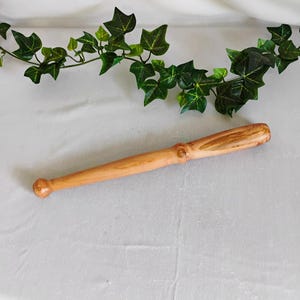 May include: A set of three ceramic mugs with a speckled, matte finish. The mugs are in shades of cream, light gray, and dark gray. Each mug has a simple, minimalist design, perfect for coffee or tea.