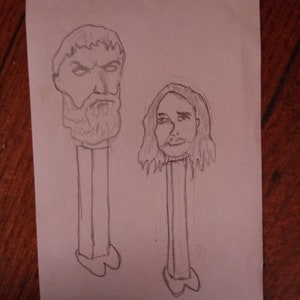 Może przedstawiać: Rysunek ołówkiem dwóch głów osób na górze stojaka na ołówki. Osoba po lewej ma brodę, a osoba po prawej ma długie włosy.