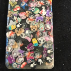 Resin rectangular pendant necklace with inlay of small ghost cub characters