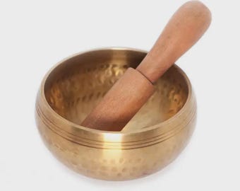 Hammer Beating Singing Bowl