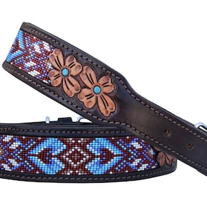 May include: Two brown leather dog collars. The collars feature a beaded design in blue, white, and maroon. The collars also have embossed floral designs with turquoise accents. The collars have a silver-colored buckle.