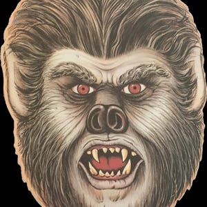 May include: A vintage Halloween mask featuring a werewolf face. The mask has a detailed design with gray fur, red eyes, and sharp teeth. The mask is made of cardboard and has a hole at the top for hanging.