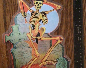 Vintage Halloween Skeleton in Graveyard Laminated Cut Out Decoration