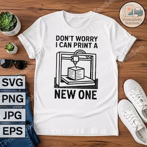 May include: White t-shirt with the text "DON'T WORRY I CAN PRINT A NEW ONE" and a graphic of a 3D printer. The shirt is displayed on a wooden surface with other items, including sunglasses and a pair of white sneakers.