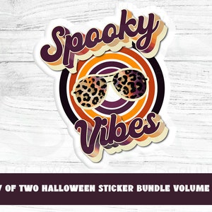 May include: A white sticker with a retro-style design featuring the text "Spooky Vibes" in purple with orange and yellow accents. The sticker also includes a pair of sunglasses with a leopard print design.
