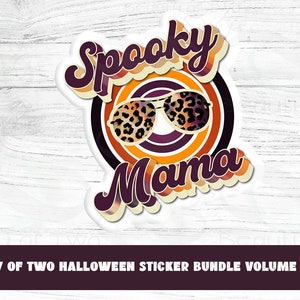 May include: A retro-style Halloween sticker with the text "Spooky Mama" in a colorful, layered font. The sticker features a pair of sunglasses with a leopard print design.