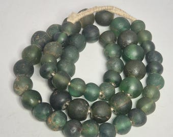 Opaque and partially transparent dark green Jatim Beads necklace, Java glass bead strand, 51 beads, 59 cm, vintage jewelry.