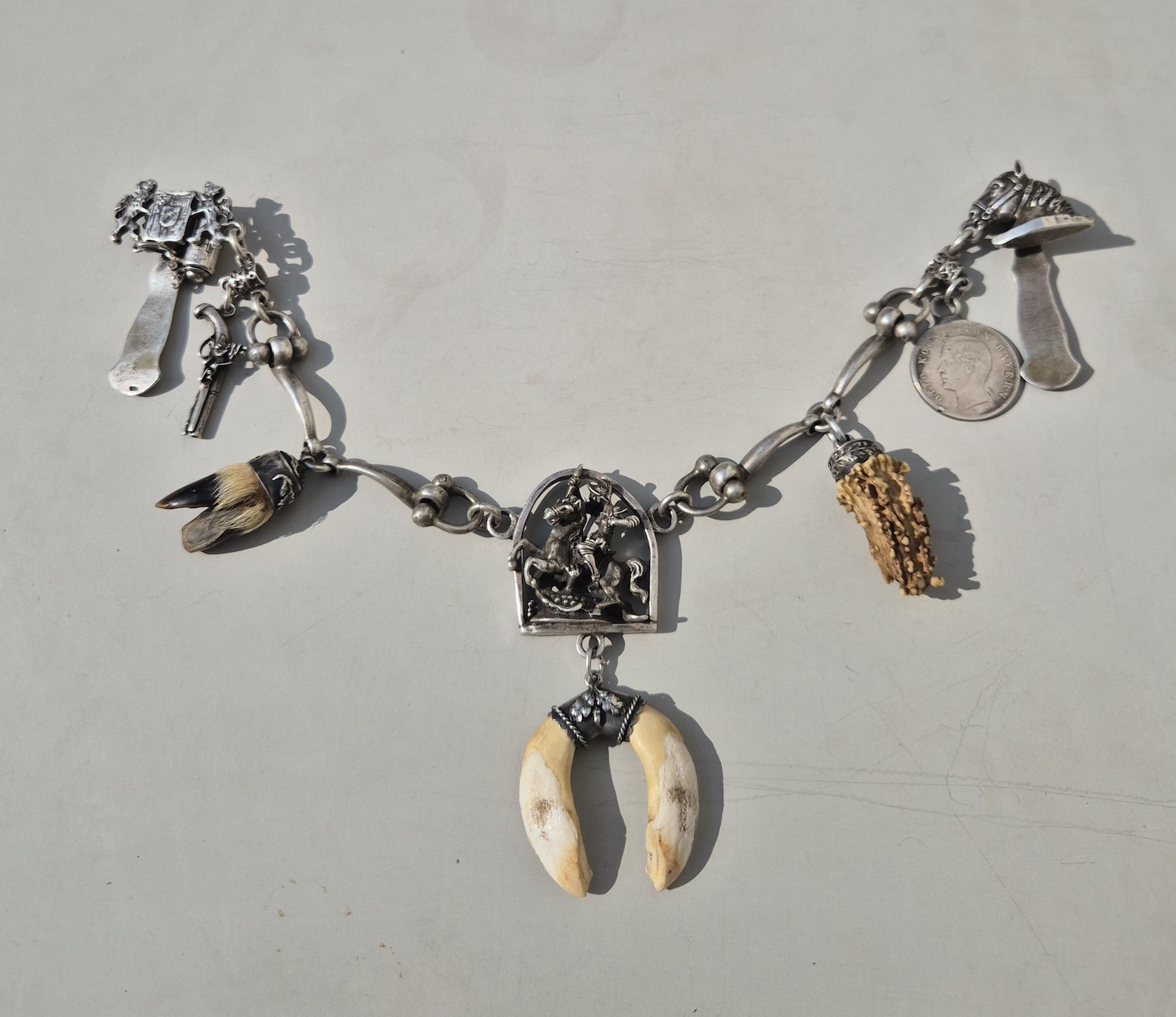 Antique charivari made of 800 silver with horse head and Saint George. Traditional jewelry for riders and collectors. 30 cm, 105 g.