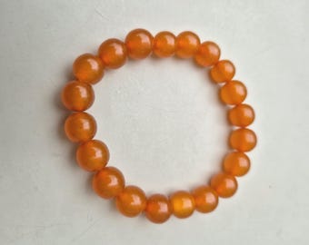 Elastic bracelet made of amber • Honey-colored beads • Pressed amber approx. 1950 • Ø 59mm • 12.63g • 867