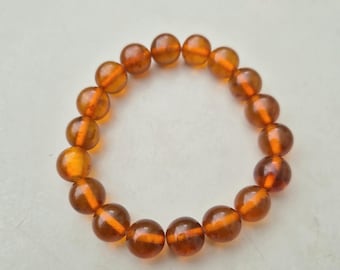 Art Deco bracelet made of cognac amber • Elastic • Beads Ø 11.49mm • 16.30g • Vintage around 1930 • 864