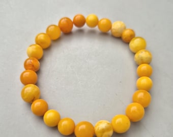 Elastic bracelet made of antique amber • Butterscotch • Cut & polished • 56mm Ø • 7.19g • 887