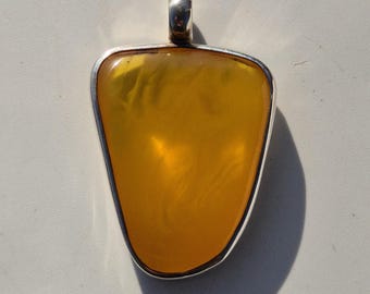 Minimalist pendant made of 925 silver with Baltic amber – Tribal Spirit Design