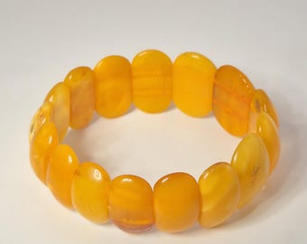 Elastic amber bracelet, cabochon oval, yellow-orange, vintage circa 1960, Schmuckrausch vintage 1984