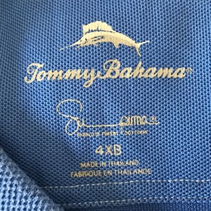 May include: A blue Tommy Bahama polo shirt with a marlin fish logo and the text "Tommy Bahama" and "Pima World's Finest Cotton". The shirt size is 4XB and is made in Thailand.
