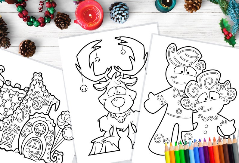 May include: Three Christmas-themed coloring pages featuring line art of a gingerbread house, a reindeer with bells, and gingerbread people. Colored pencils are visible at the bottom right, with holiday decorations in the background.