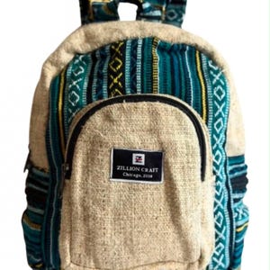 May include: A backpack featuring a woven pattern in teal, black, and yellow stripes with beige fabric accents. The front pocket has a black rectangular label with the text ZILLION CRAFT Chicago, 2018. It includes two shoulder straps and a top handle.